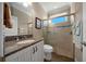 Bathroom showcasing a vanity with granite countertops, tile shower, and modern fixtures at 4687 Nw 35Th Lane Rd, Ocala, FL 34482