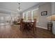 Comfortable breakfast nook with wood floors, large windows, and seating for four at 4687 Nw 35Th Lane Rd, Ocala, FL 34482