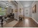 Inviting foyer with decorative glass front door, adjacent to a home office setup with desk and chair at 4687 Nw 35Th Lane Rd, Ocala, FL 34482