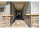Inviting covered front porch with stone accents at 4687 Nw 35Th Lane Rd, Ocala, FL 34482