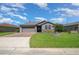 Charming single-story home with a well-manicured lawn and a brick-paved driveway at 4687 Nw 35Th Lane Rd, Ocala, FL 34482