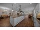 Open-concept kitchen featuring a center island, pendant lights, and stainless steel appliances at 4687 Nw 35Th Lane Rd, Ocala, FL 34482