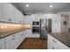 Kitchen featuring white cabinets, stainless appliances, granite countertops, and tiled backsplash at 4687 Nw 35Th Lane Rd, Ocala, FL 34482
