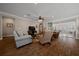 Open floor plan view to sun room with wood floors, sliders, and crown molding at 4687 Nw 35Th Lane Rd, Ocala, FL 34482
