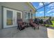 Screened patio featuring comfortable seating and an outdoor grill, perfect for entertaining and relaxing at 4687 Nw 35Th Lane Rd, Ocala, FL 34482