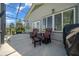 The screened porch boasts outdoor seating, a grill, and a relaxing atmosphere at 4687 Nw 35Th Lane Rd, Ocala, FL 34482