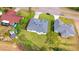 Aerial view showcases home's roof, landscaping and neighborhood at 492 Marion Oaks Mnr, Ocala, FL 34473