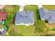 Birds eye view shows roof and green backyard and sideyard at 492 Marion Oaks Mnr, Ocala, FL 34473