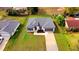 Aerial view of a newly built home featuring a well-manicured lawn at 492 Marion Oaks Mnr, Ocala, FL 34473