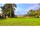 Grassy backyard with scattered trees at 492 Marion Oaks Mnr, Ocala, FL 34473