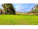 Spacious backyard of a home with well-maintained lawn and trees at 492 Marion Oaks Mnr, Ocala, FL 34473