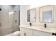Bathroom with double sink vanity, modern fixtures, and glass-enclosed shower at 492 Marion Oaks Mnr, Ocala, FL 34473