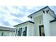 Stylish exterior showcasing modern architectural elements, contrasting trim, and an inviting entry area at 492 Marion Oaks Mnr, Ocala, FL 34473