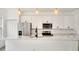 Kitchen with stainless steel appliances and white cabinets with hardware and a center island at 492 Marion Oaks Mnr, Ocala, FL 34473