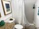 Bright bathroom features a shower-tub combo with white textured shower curtain at 510 Cranes Way # 206, Altamonte Springs, FL 32701