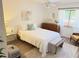 Cozy bedroom with a plush bed and natural light at 510 Cranes Way # 206, Altamonte Springs, FL 32701