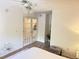 Bright bedroom with wood-look floors and French doors at 510 Cranes Way # 206, Altamonte Springs, FL 32701