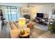 Open-concept living room with tile floors and views to the balcony at 510 Cranes Way # 206, Altamonte Springs, FL 32701