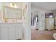 Charming powder room featuring framed mirror, modern sink and vanity, and decor accents at 512 Derby Dr, Altamonte Springs, FL 32714