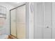 This bathroom showcases a glass-enclosed shower, toilet, and storage cabinet at 512 Derby Dr, Altamonte Springs, FL 32714