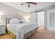 Bright bedroom with a king bed, barn door to closet, and neutral color palette at 512 Derby Dr, Altamonte Springs, FL 32714