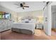 This spacious bedroom boasts a ceiling fan, an ensuite bath and a large window at 512 Derby Dr, Altamonte Springs, FL 32714