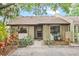 Charming home featuring lush landscaping, mature trees, and a welcoming entrance at 512 Derby Dr, Altamonte Springs, FL 32714