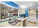 Updated kitchen features open view into the living room and stainless steel sink at 512 Derby Dr, Altamonte Springs, FL 32714