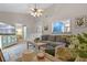 Cozy living room featuring neutral colors and an open view into the kitchen at 512 Derby Dr, Altamonte Springs, FL 32714