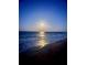 Enjoy ocean views from this balcony overlooking a sandy beach, waves and moonlit water at 5203 S Atlantic Ave # 416B, New Smyrna Beach, FL 32169
