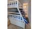 Charming bunk bedroom featuring fun nautical-themed decor and comfortable bedding at 5203 S Atlantic Ave # 416B, New Smyrna Beach, FL 32169