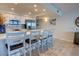 Bright kitchen with updated appliances and seating at the center island at 5203 S Atlantic Ave # 416B, New Smyrna Beach, FL 32169