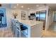 Well-equipped kitchen island with seating and modern appliances at 5203 S Atlantic Ave # 416B, New Smyrna Beach, FL 32169