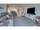 Open floor plan with a living room featuring comfortable seating and direct access to the kitchen area at 5203 S Atlantic Ave # 416B, New Smyrna Beach, FL 32169