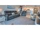 Open-concept living room showcasing an adjacent kitchen and comfortable seating arrangements at 5203 S Atlantic Ave # 416B, New Smyrna Beach, FL 32169