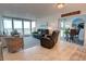 Cozy living room with ocean views, comfortable seating, and coastal decor at 5203 S Atlantic Ave # 416B, New Smyrna Beach, FL 32169