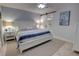Serene bedroom with a king-size bed, soft lighting, and ensuite bath access at 5203 S Atlantic Ave # 416B, New Smyrna Beach, FL 32169