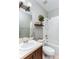 Bright bathroom with a plant shelf in the shower and a single sink vanity at 558 Pinebranch Cir, Winter Springs, FL 32708
