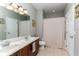 Bright bathroom featuring a double sink vanity with a shower and tub combination at 558 Pinebranch Cir, Winter Springs, FL 32708