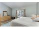 The primary bedroom boasts ample natural light and a large dresser for storage at 558 Pinebranch Cir, Winter Springs, FL 32708