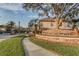 Inviting view of the Barclay Reserve community entrance with lush landscaping and a stone sign at 558 Pinebranch Cir, Winter Springs, FL 32708