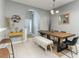 Stylish dining area with tile floors, a wooden table, and decor accents, seamlessly connecting to the kitchen area at 558 Pinebranch Cir, Winter Springs, FL 32708
