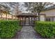 Community gazebo featuring a pathway, privacy hedges, and views of the property at 558 Pinebranch Cir, Winter Springs, FL 32708