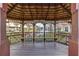 Community gazebo with seating overlooking a serene pond with manicured lawns at 558 Pinebranch Cir, Winter Springs, FL 32708