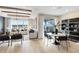 A bright and airy living room, flows seamlessly into a dining area, with sliding glass doors at 5604 Wood Bridge Pl, St Cloud, FL 34771