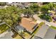 Aerial view of a charming home featuring a screened-in pool and fenced backyard in a lush, green neighborhood at 581 Hollingshead Loop, Davenport, FL 33896