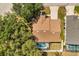 Aerial view of a charming home featuring a screened-in pool and fenced backyard in a lush, green neighborhood at 581 Hollingshead Loop, Davenport, FL 33896