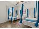 Whimsical bedroom with two twin beds, white curtains, and charming mermaid decor at 581 Hollingshead Loop, Davenport, FL 33896