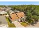 Charming single-Gathering home boasts well-maintained landscaping, a concrete driveway, and an attached two-car garage at 581 Hollingshead Loop, Davenport, FL 33896