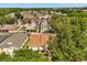 Charming single-Gathering home boasts well-maintained landscaping, a concrete driveway, and an attached two-car garage at 581 Hollingshead Loop, Davenport, FL 33896